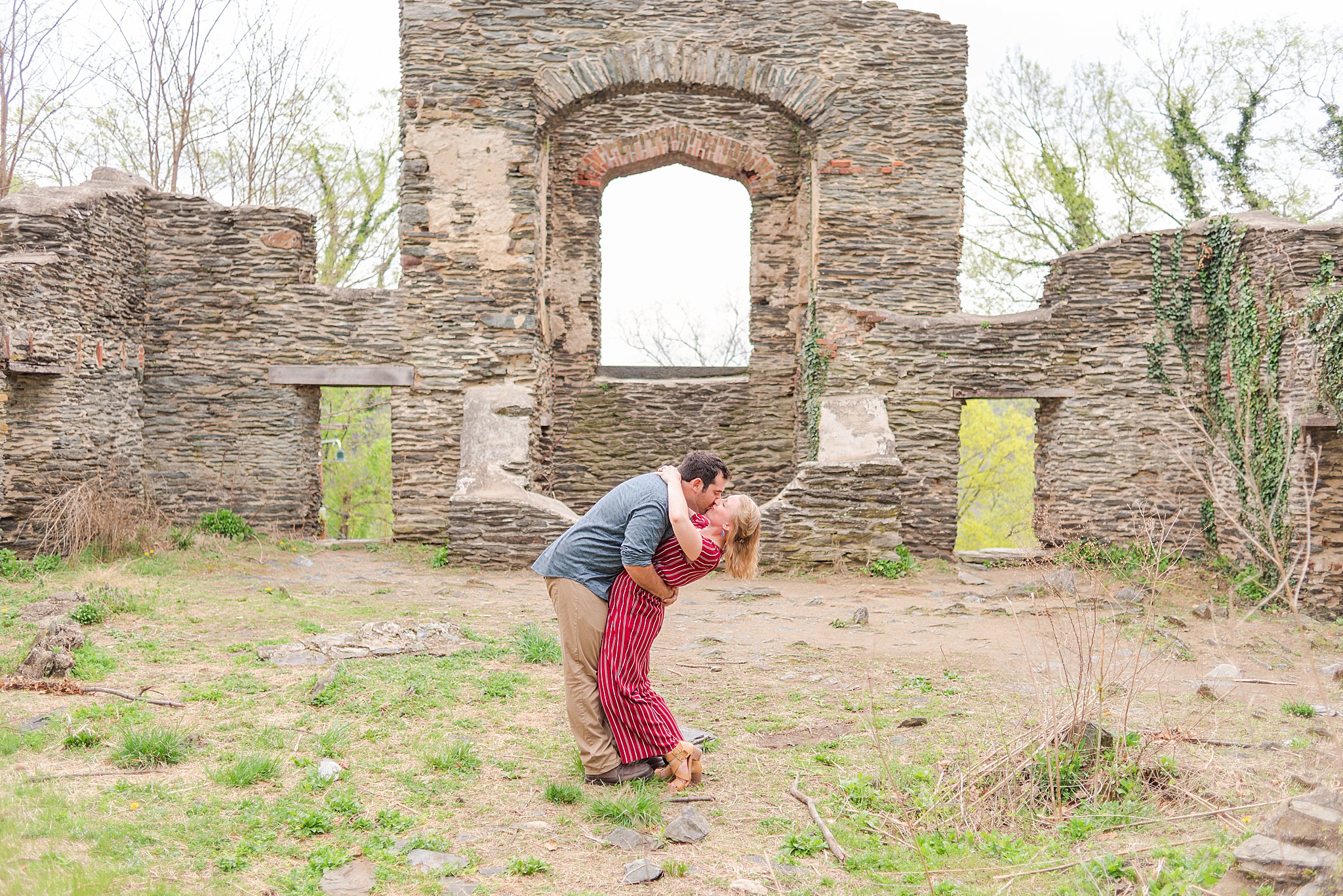 Couple kisses inside old church ruins in Harpers Ferry, West Virginia.