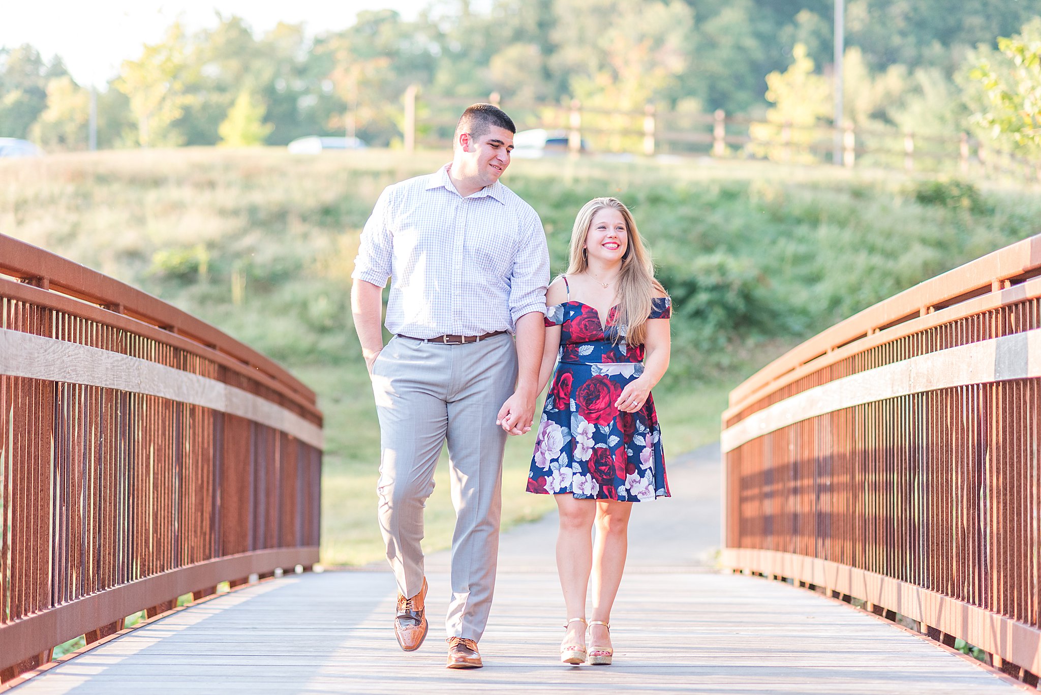 Couple crossing a bridge in Occoquan Regional Park - Engagement Session
