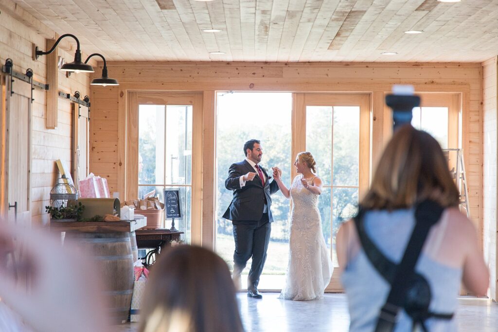 Loudoun County Photographer photographing a couples entrance into The Barn at Willow Brook