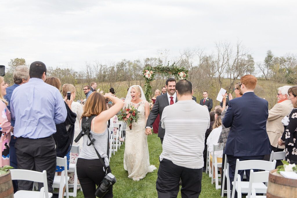 Loudoun County Photographer Behind the Scenes Wedding Recessional at The Barn at Willow Brook