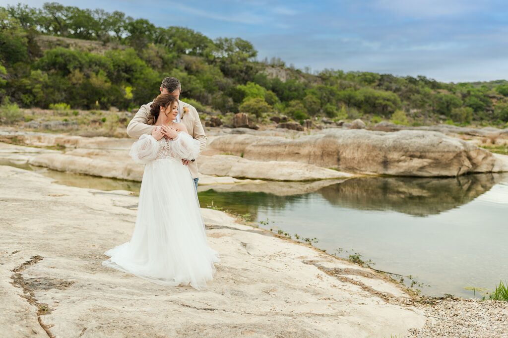 A tender embrace during an Elopement at Pedernales Falls State Park, just outside of Austin Texas.